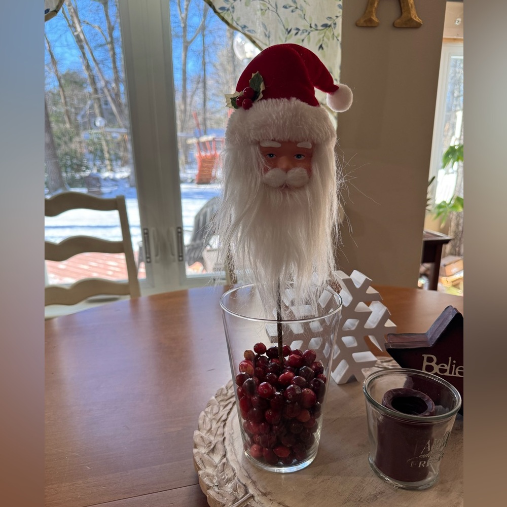 Festive Santa Claus Holiday Decoration on metal stem